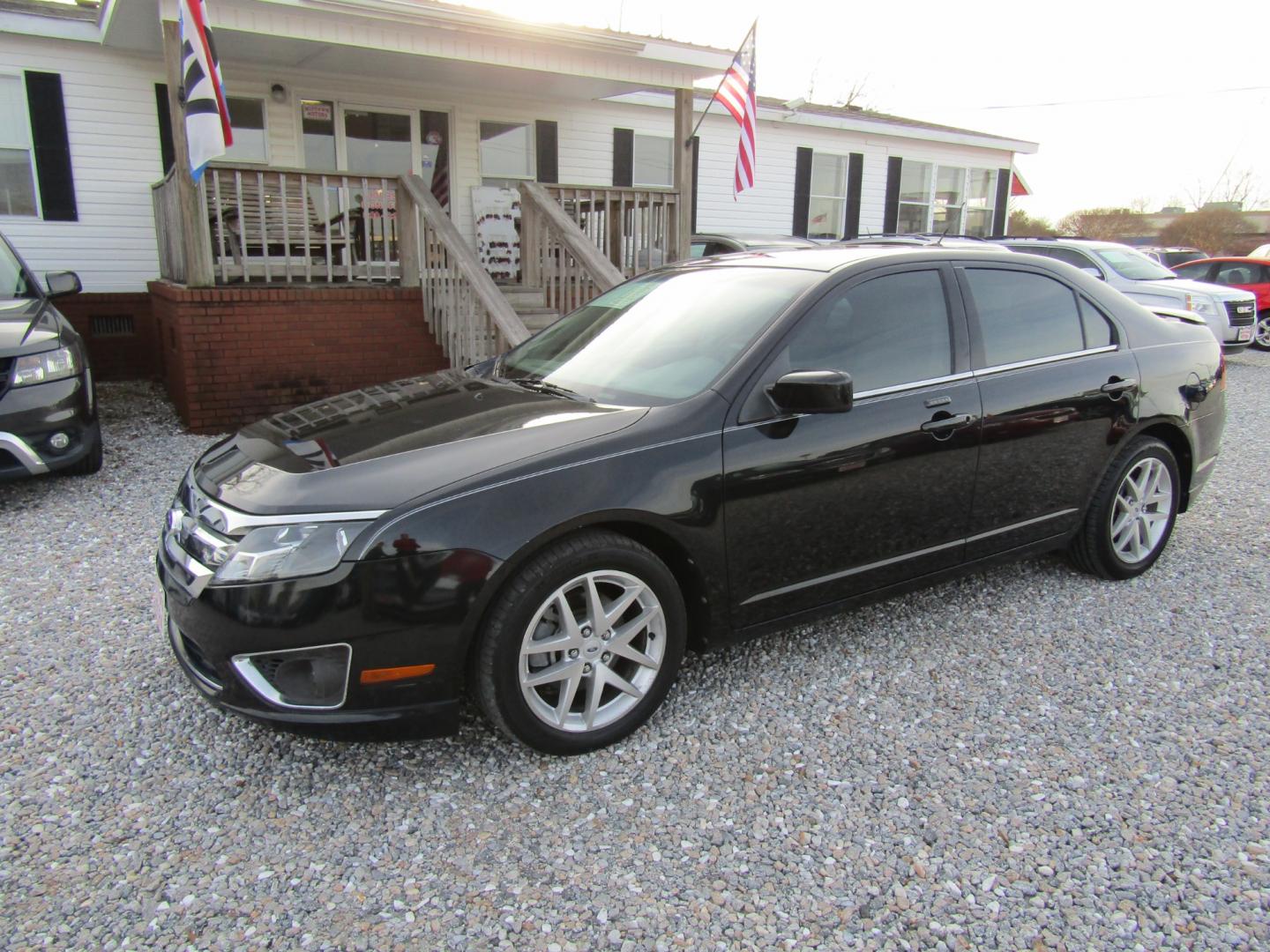 2011 Black /Tan Ford Fusion (3FAHP0JG4BR) , Automatic transmission, located at 15016 S Hwy 231, Midland City, AL, 36350, (334) 983-3001, 31.306210, -85.495277 - Photo#2